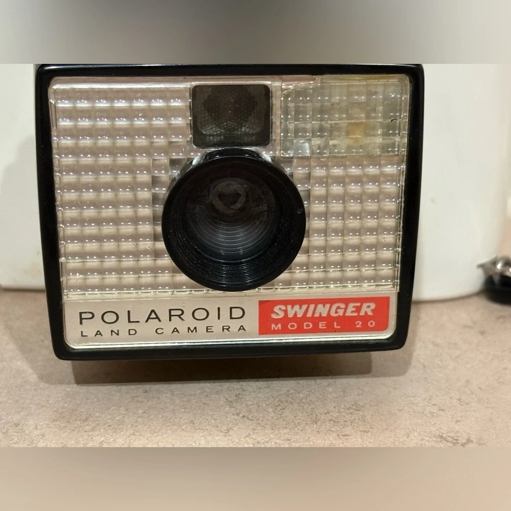 Vintage Polaroid Swinger camera and case